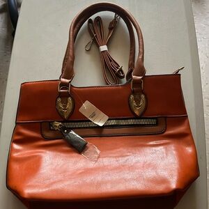 Burnt orange medium size faux leather bag long strap included.